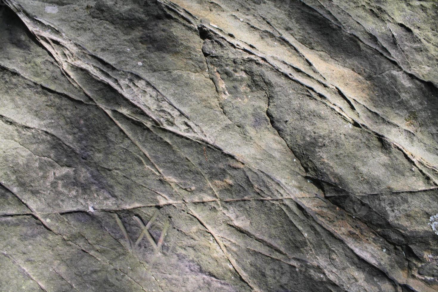 vista de cerca en una textura de pared de granito y piedra en alta resolución. foto