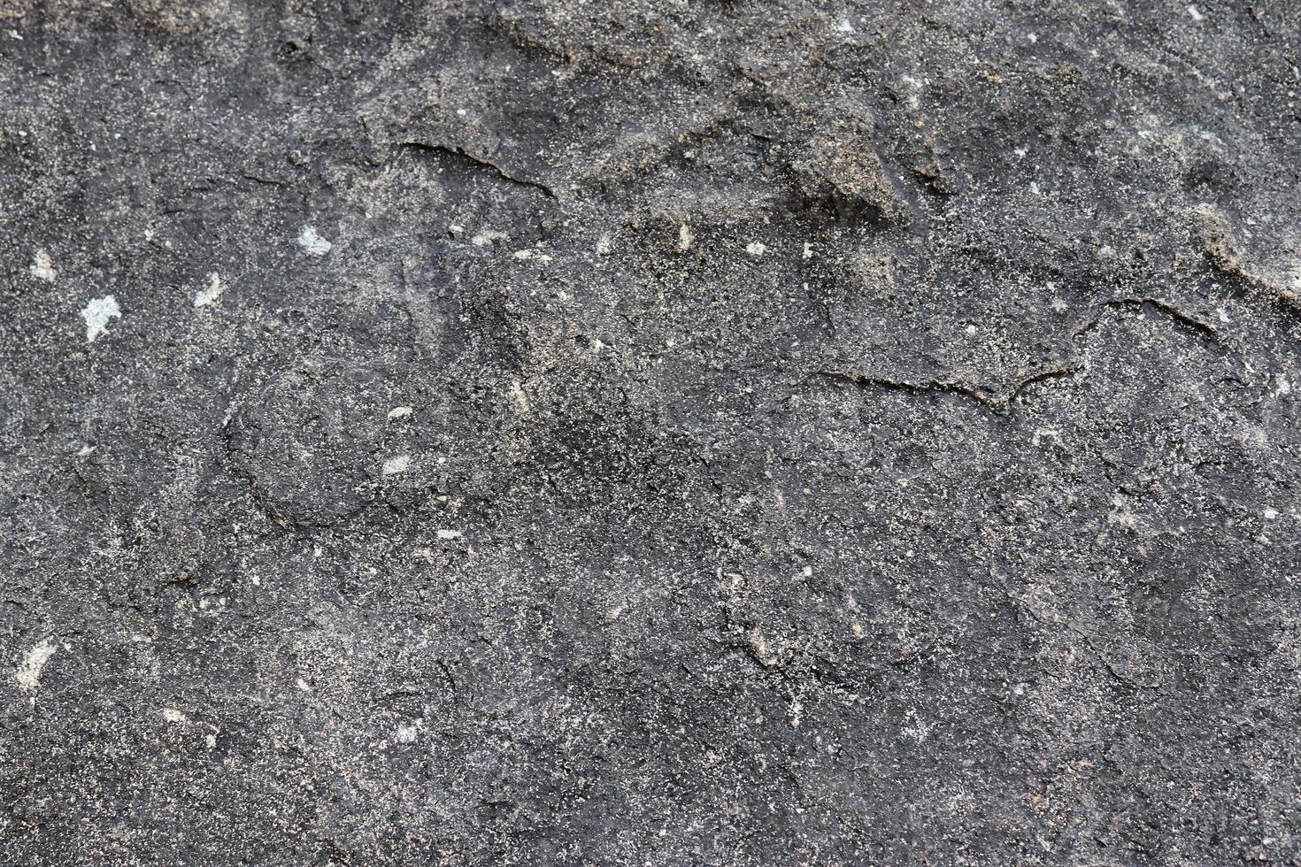 vista de cerca en una textura de pared de granito y piedra en alta resolución. foto