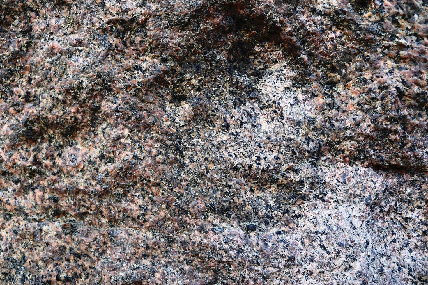 vista de cerca en una textura de pared de granito y piedra en alta resolución. foto