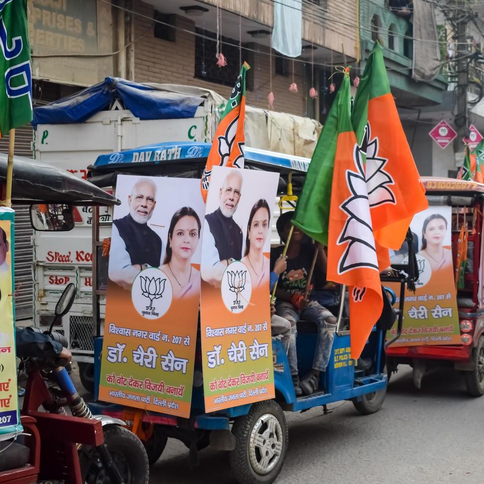 Delhi, India, December 02 2022  - Bharatiya Janata Party BJP supporter during mega road show in support of BJP candidate Pankaj Luthara to file nomination papers ahead of MCD local body Elections 2022 photo