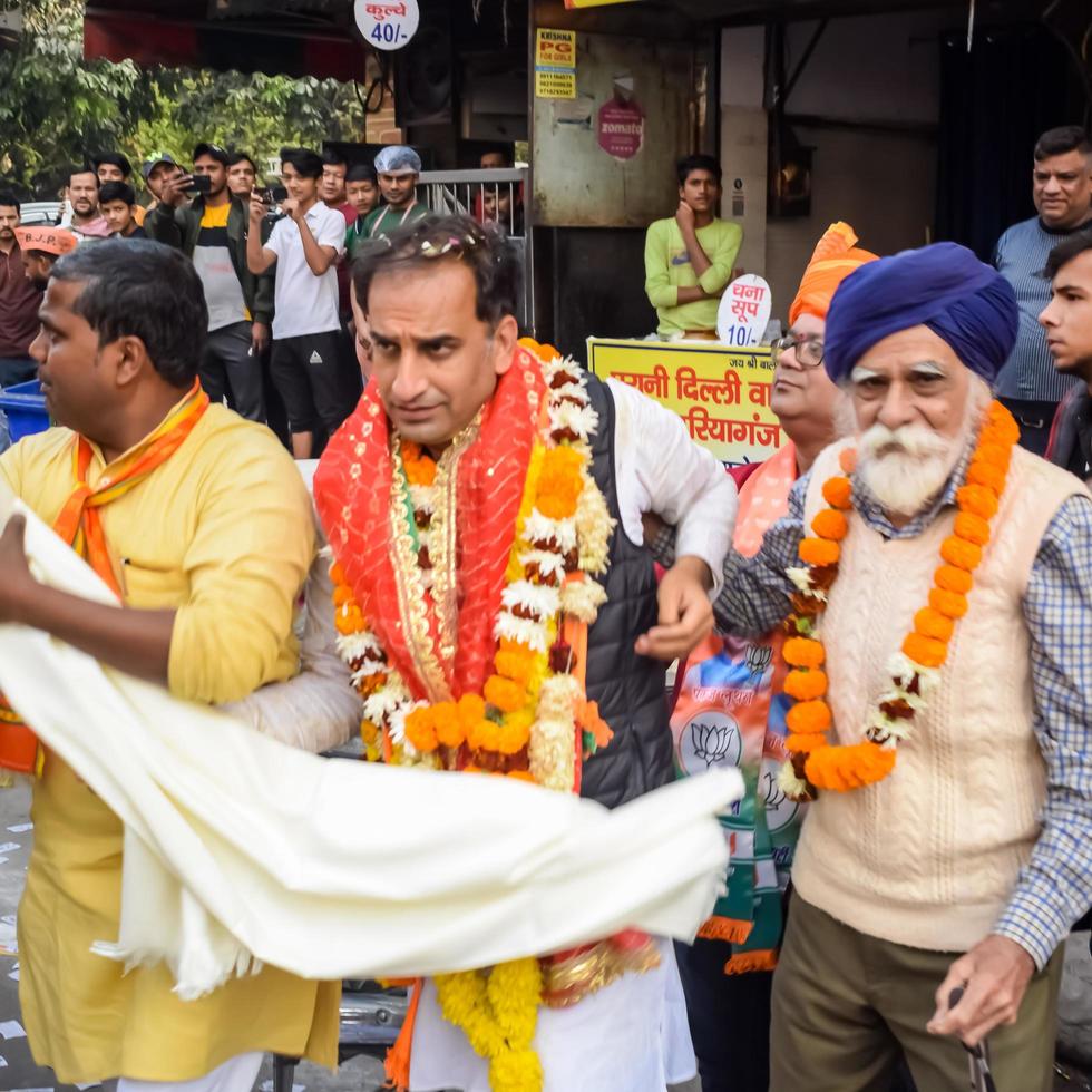 Delhi, India, December 02 2022  - Bharatiya Janata Party BJP supporter during mega road show in support of BJP candidate Pankaj Luthara to file nomination papers ahead of MCD local body Elections 2022 photo