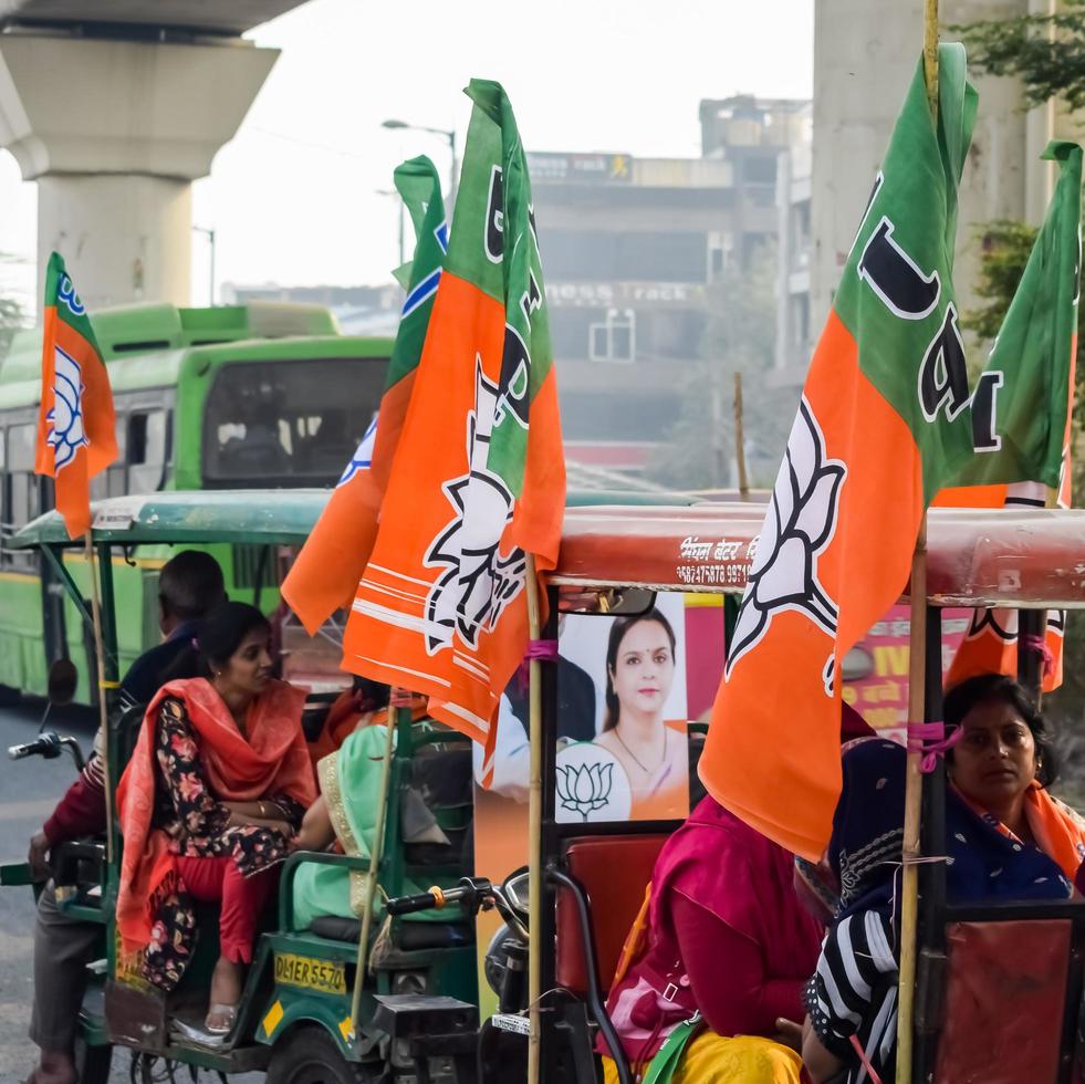 Delhi, India, December 02 2022  - Bharatiya Janata Party BJP supporter during mega road show in support of BJP candidate Pankaj Luthara to file nomination papers ahead of MCD local body Elections 2022 photo