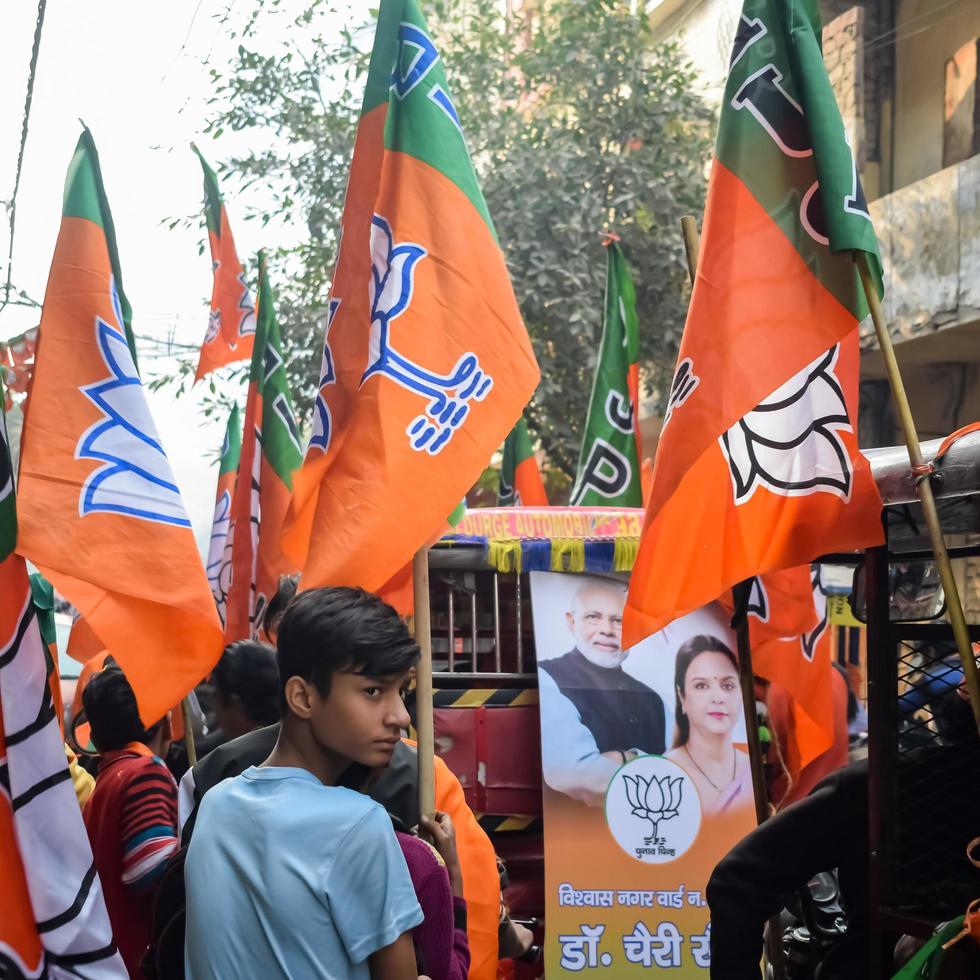 Delhi, India, December 02 2022  - Bharatiya Janata Party BJP supporter during mega road show in support of BJP candidate Pankaj Luthara to file nomination papers ahead of MCD local body Elections 2022 photo