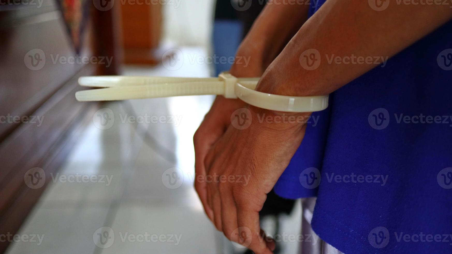 Man handcuffed hands. Prisoner or arrested. photo