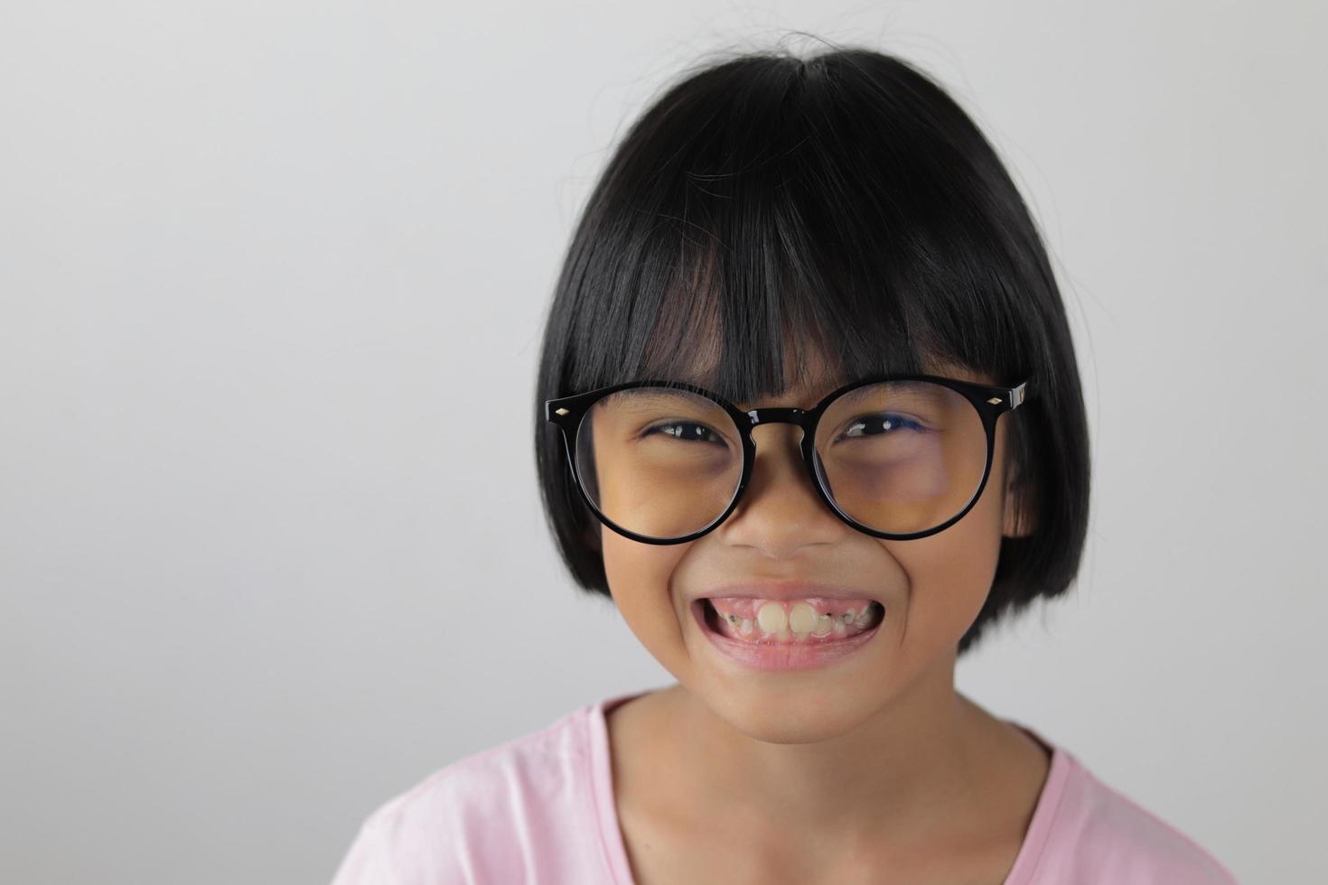 Portrait of child wearing eyeglasses with blur background photo