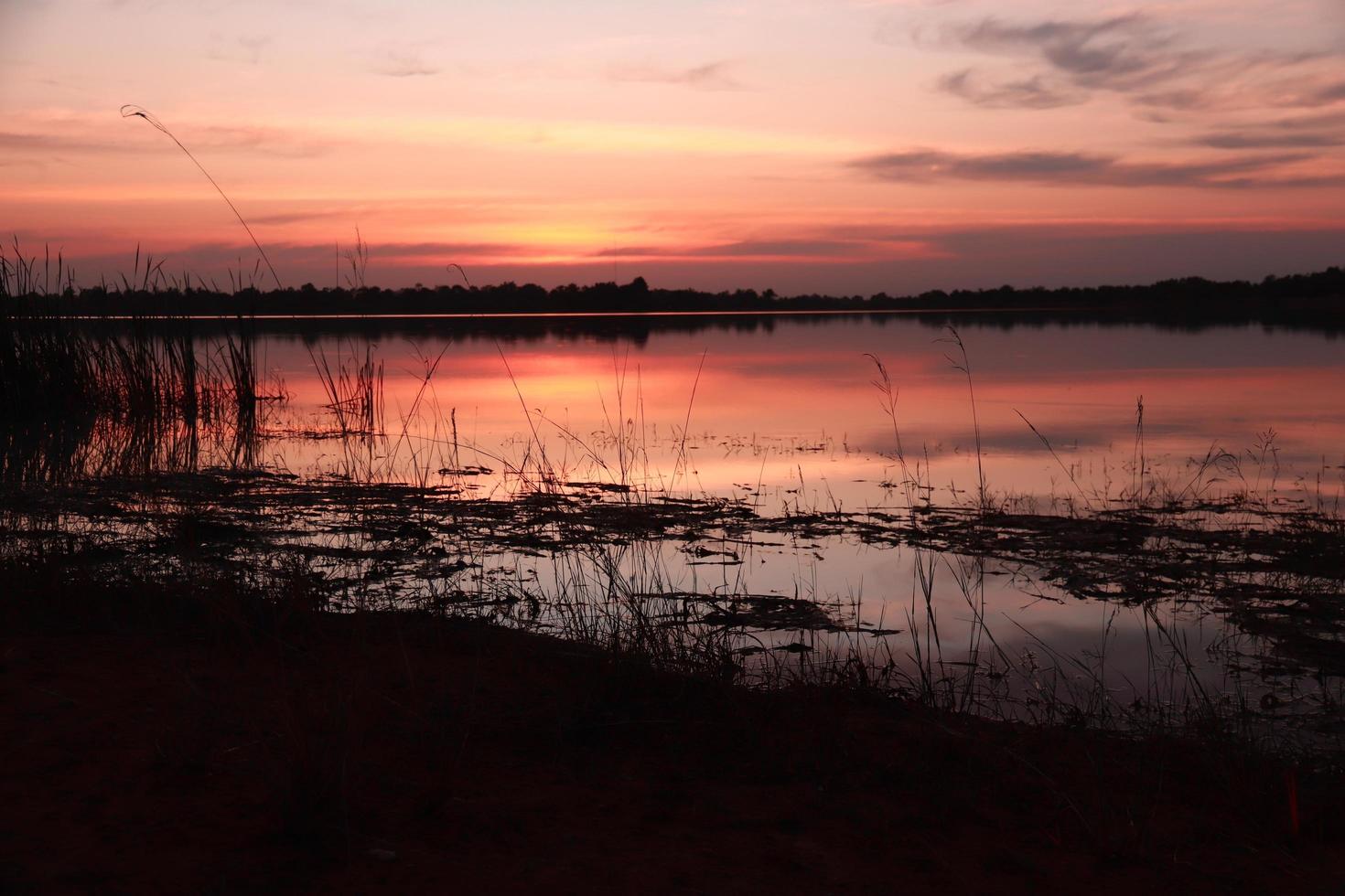 Beautiful nature view at sunset, red-orange sky view and river at sunset. photo