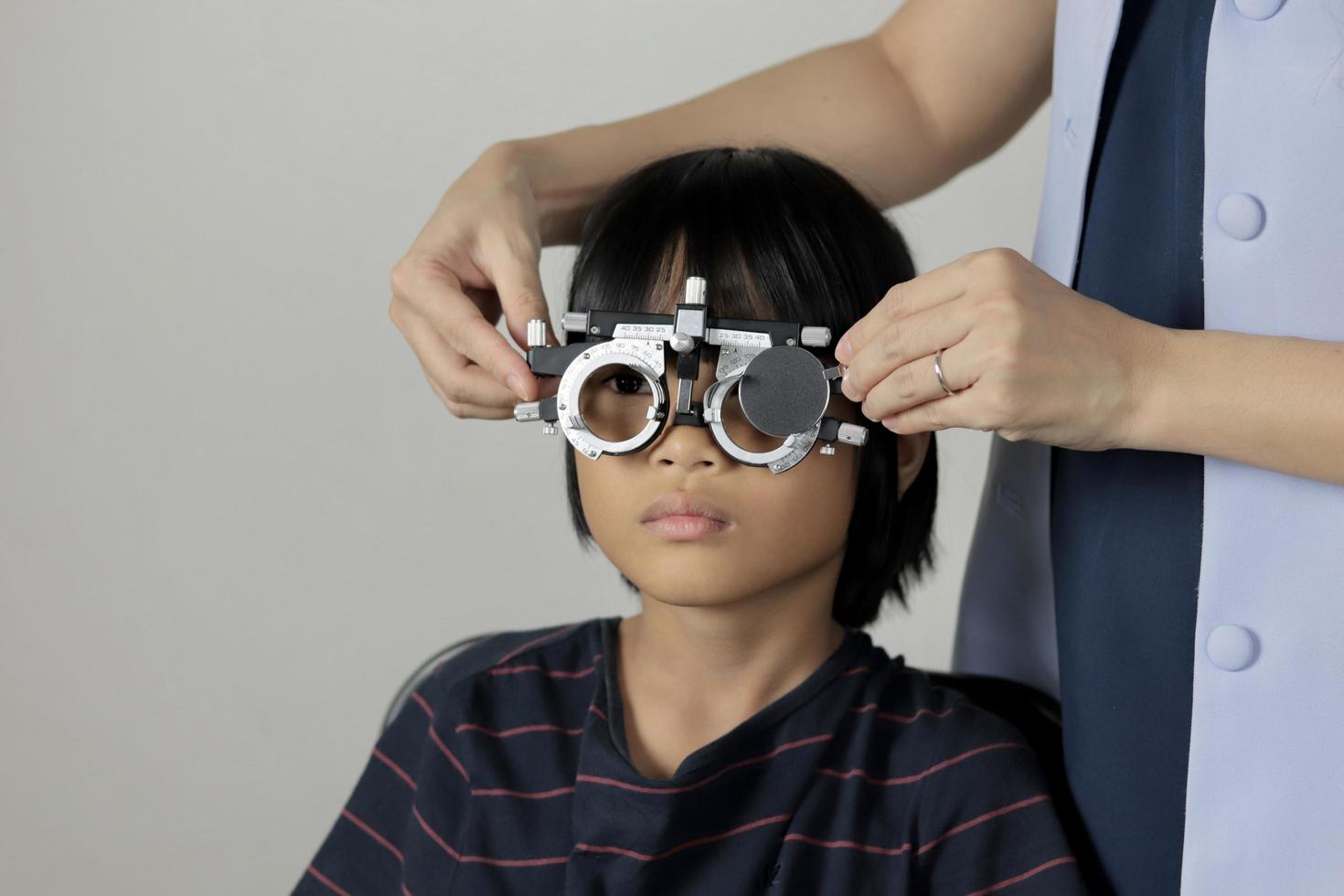 Girl eye test, kid eye test concept photo