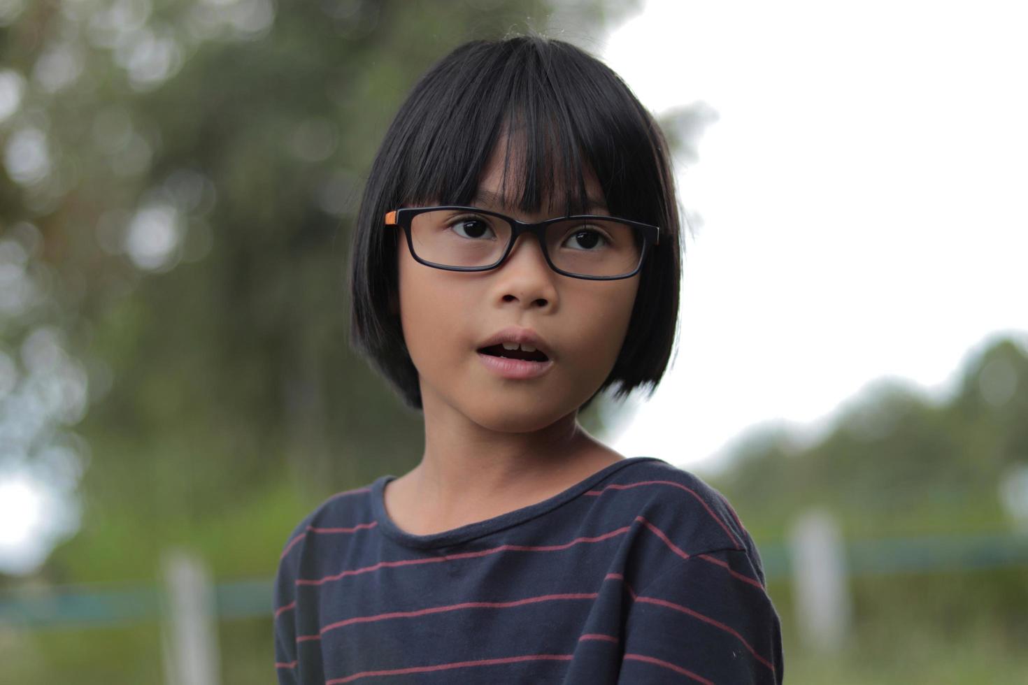 Portrait of child wearing eyeglasses photo