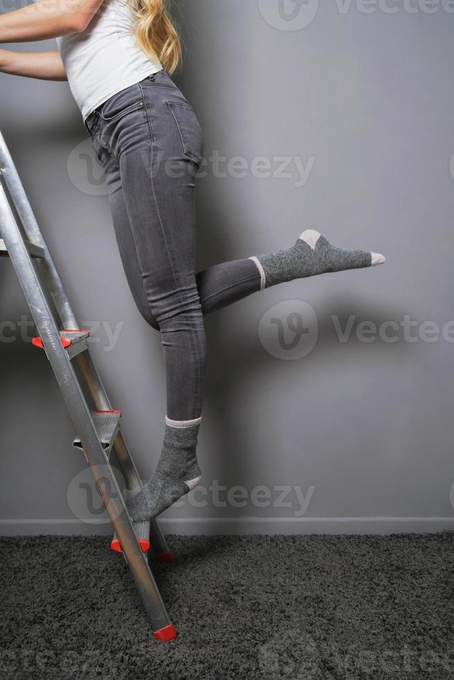 climbing ladder in socks household accident risk 16684216 Stock Photo