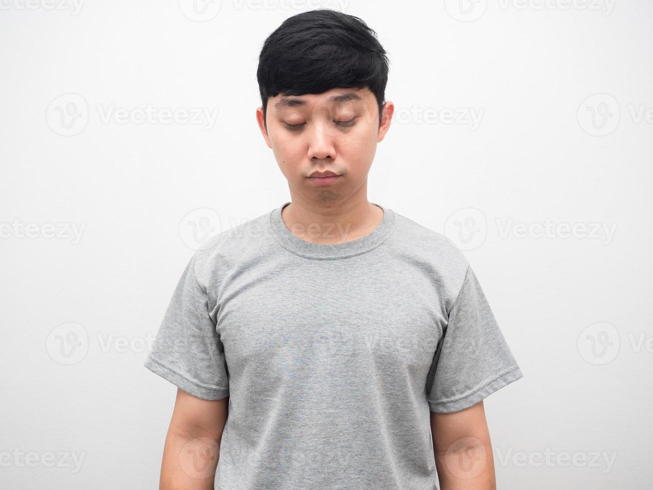 Sleepy man with black circle under the eyes studio shot photo