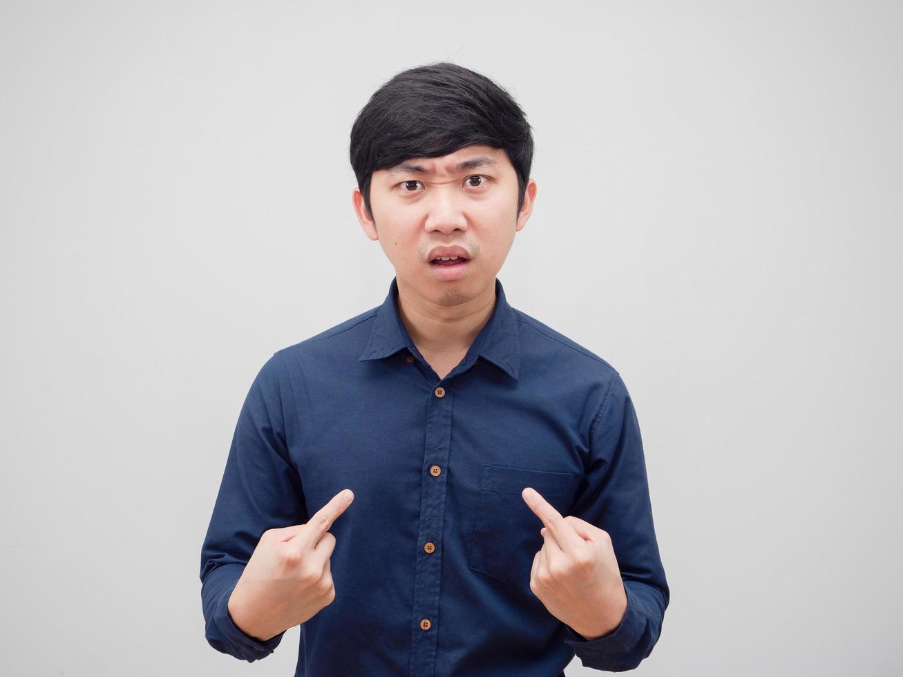 Asian man serious face point finger at himself on white background photo