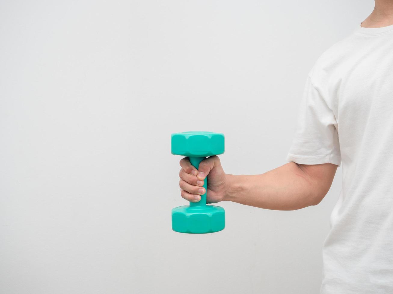 Man holding dumbbell green clolor white background crop shot copy space photo