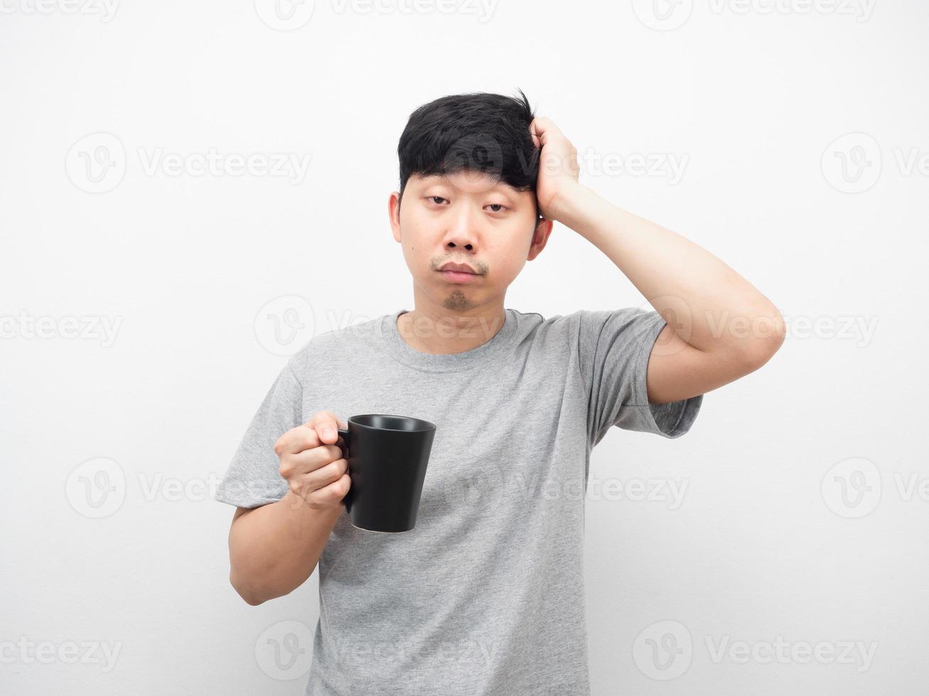 Man sleepy emotion holding coffee cup photo
