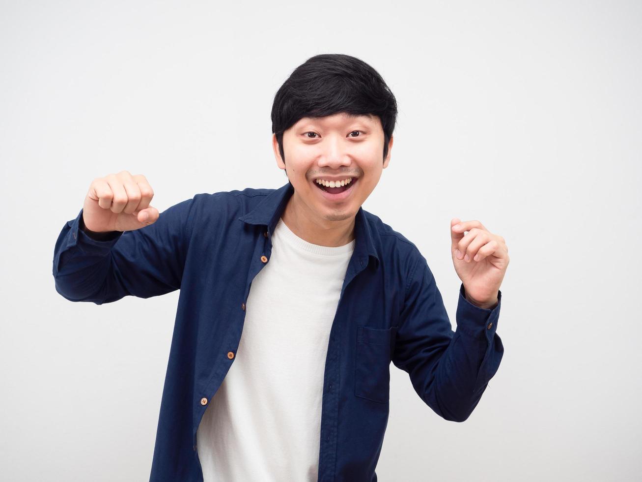 Asian man funny dancing happy emotion white background photo