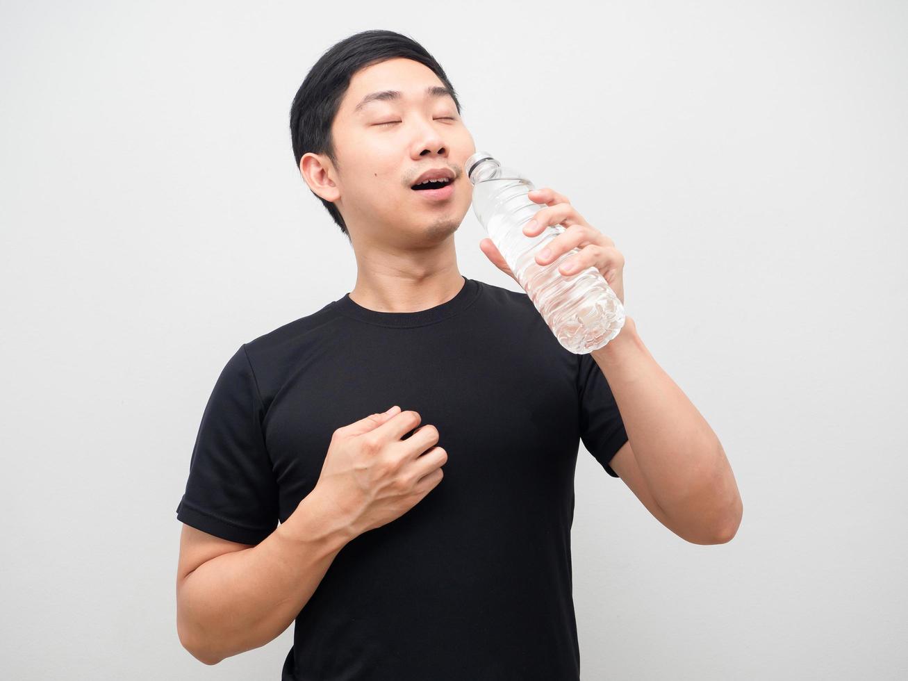 Asian man drinking water from bottle white background photo