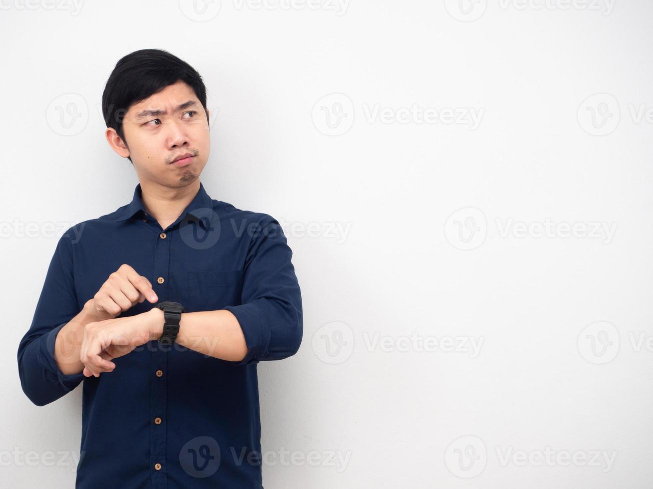 Man wearing watch serious emotion looking at copy space white background photo