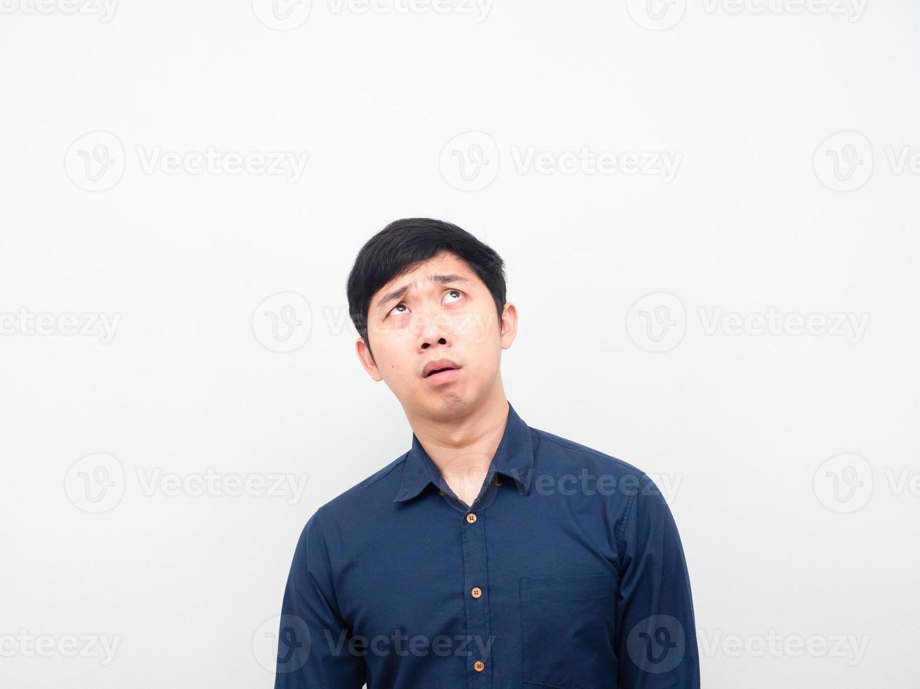 Man feeling worried emotion looking up at copy space photo