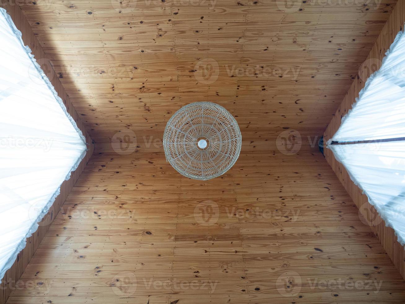 Bamboo roof in the bedroom with vintage lamp photo