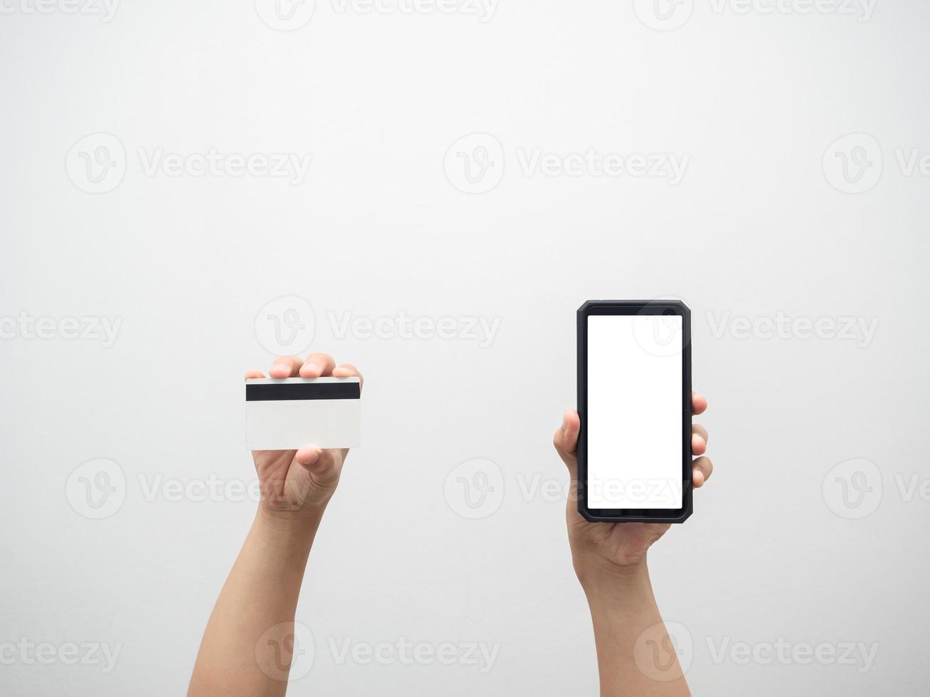 Hand holding credit card and mobile phone white screen isolated photo