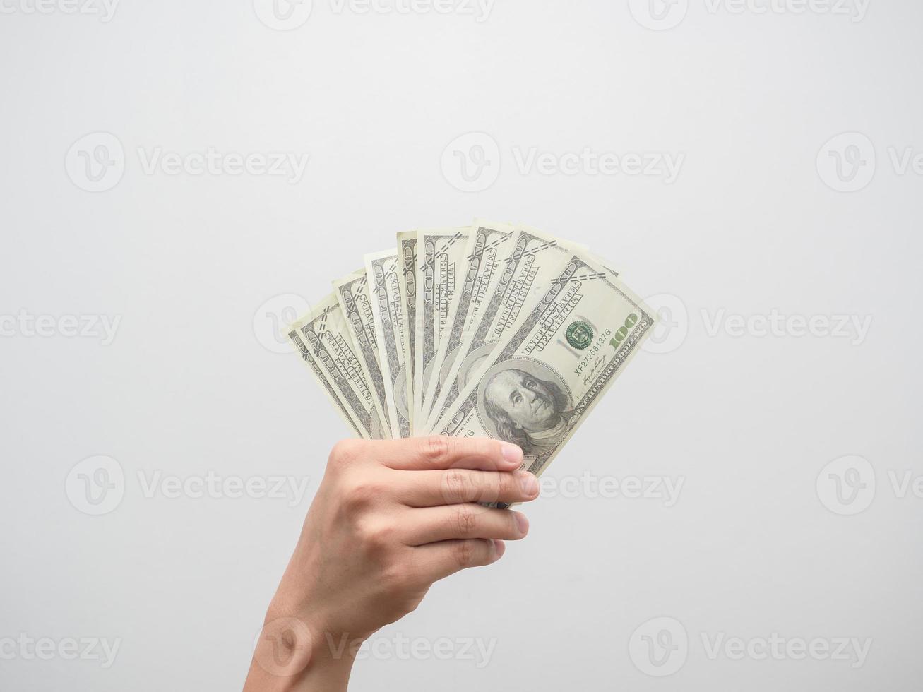 mano sosteniendo dinero dólar aislado foto