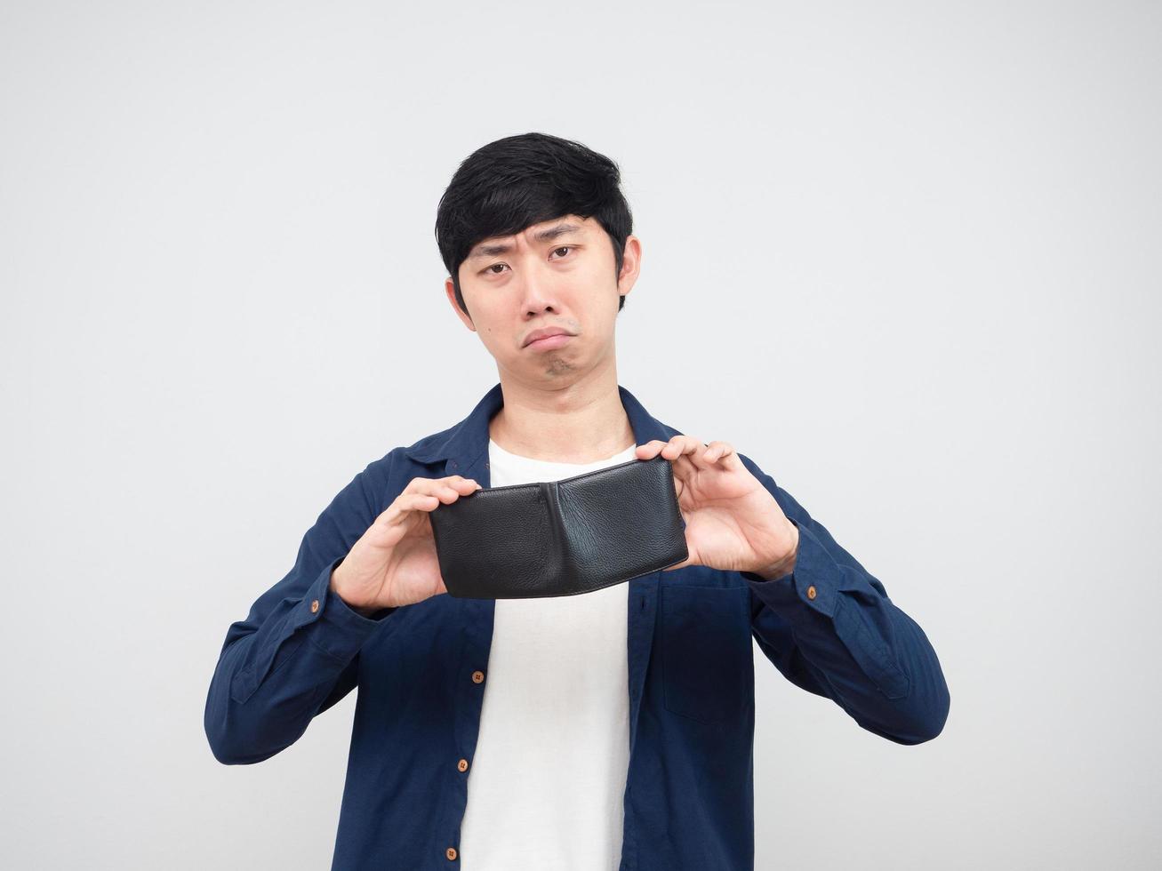 Asian man sad face show empty wallet no money in his hand portrait white background photo