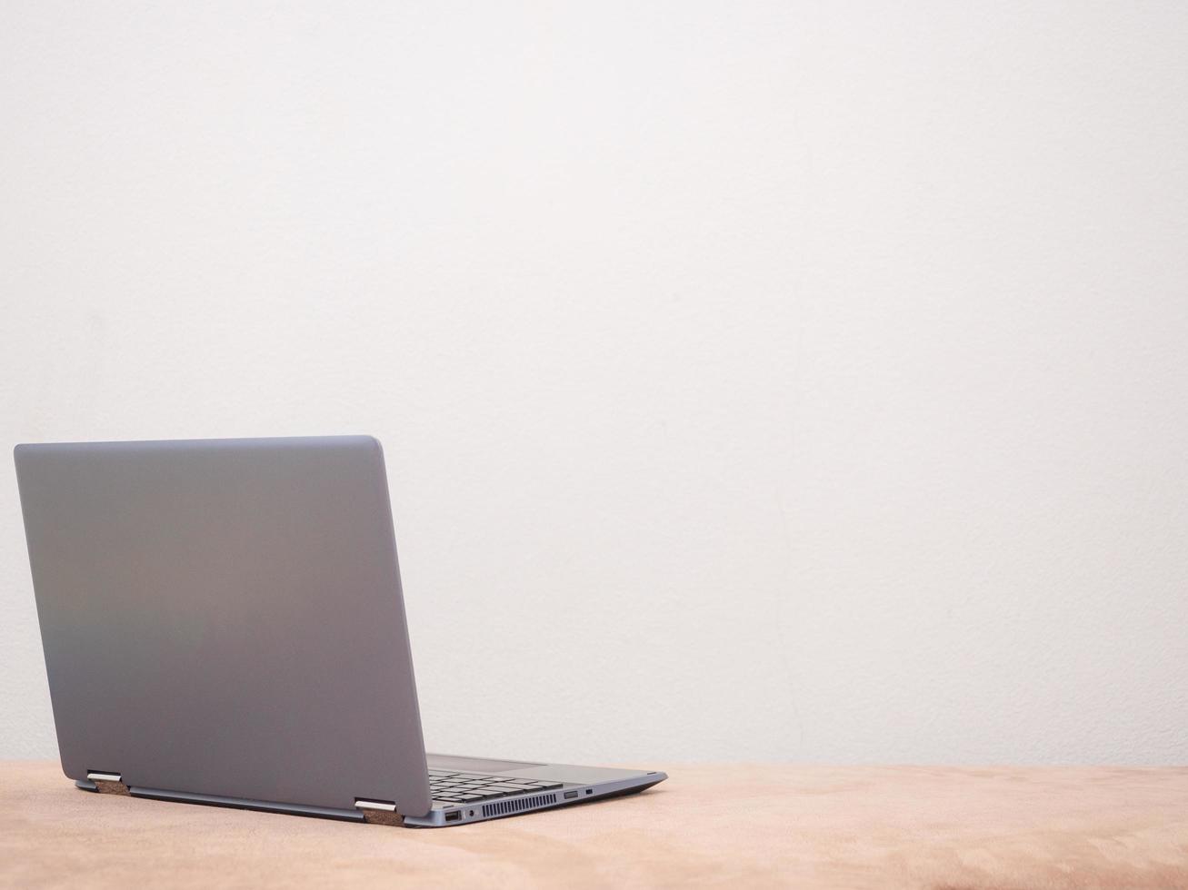 Laptop on sofa silver color on white background copy space concept photo