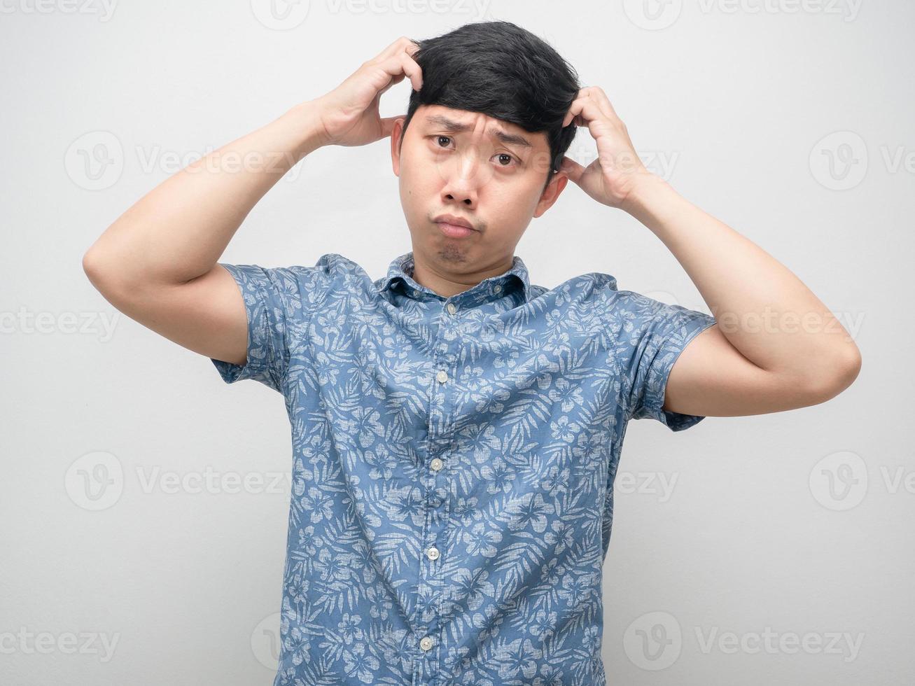 Man blue shirt feel doubt gesture scrath his head isolated photo