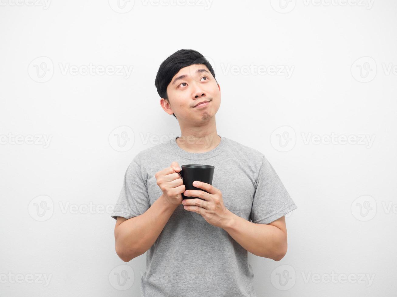 Man holding coffee cup and dreaming about something white isolated photo