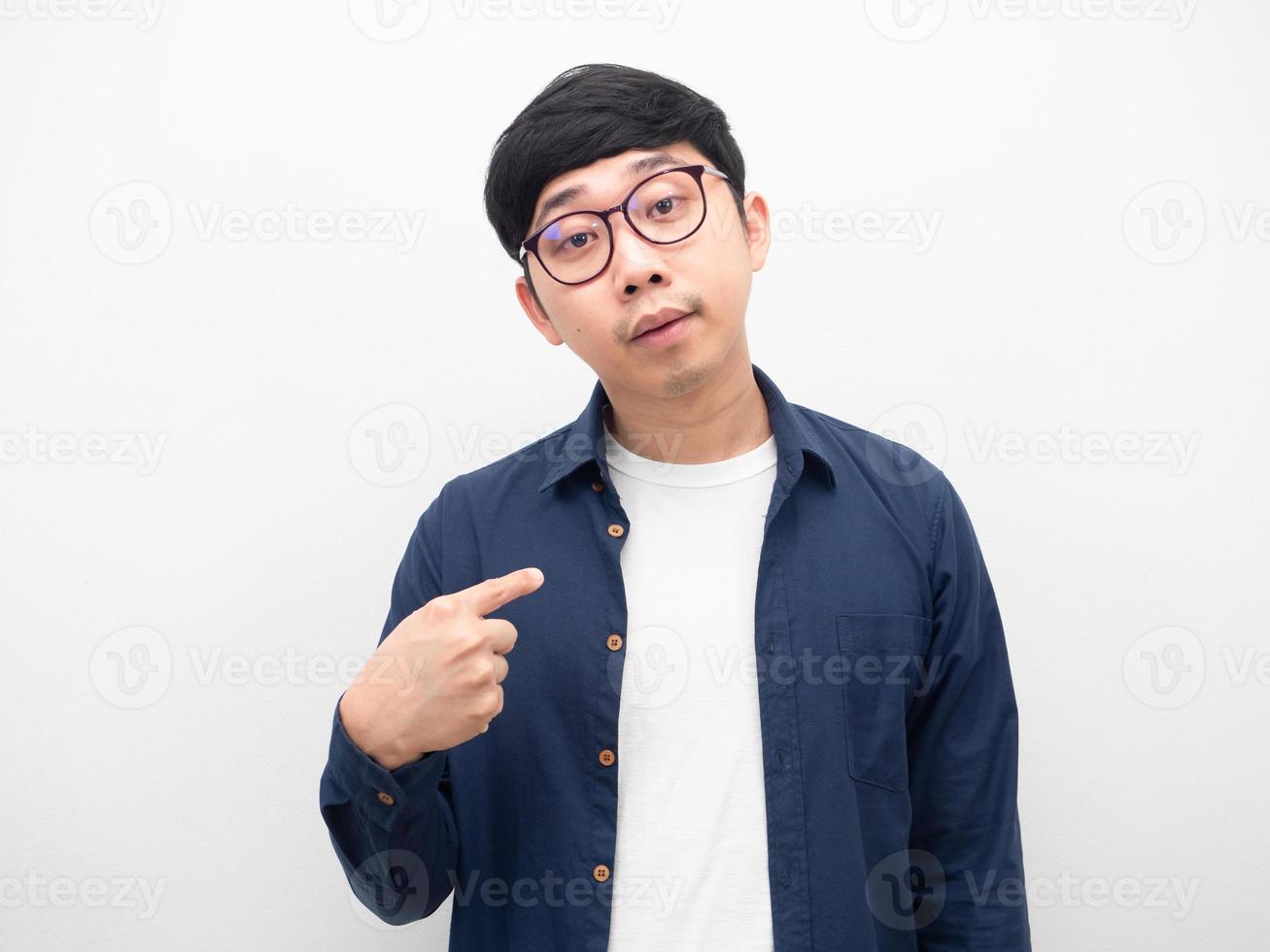 Asian man wearing glasses point finger at himself feeling bored photo