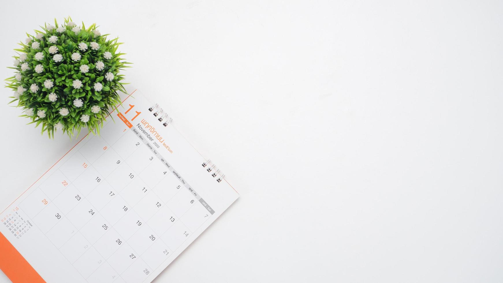 Calendar with vase top view white background on the table photo