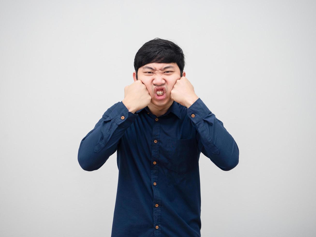 Asian man angry himself punch his face portrait white background photo