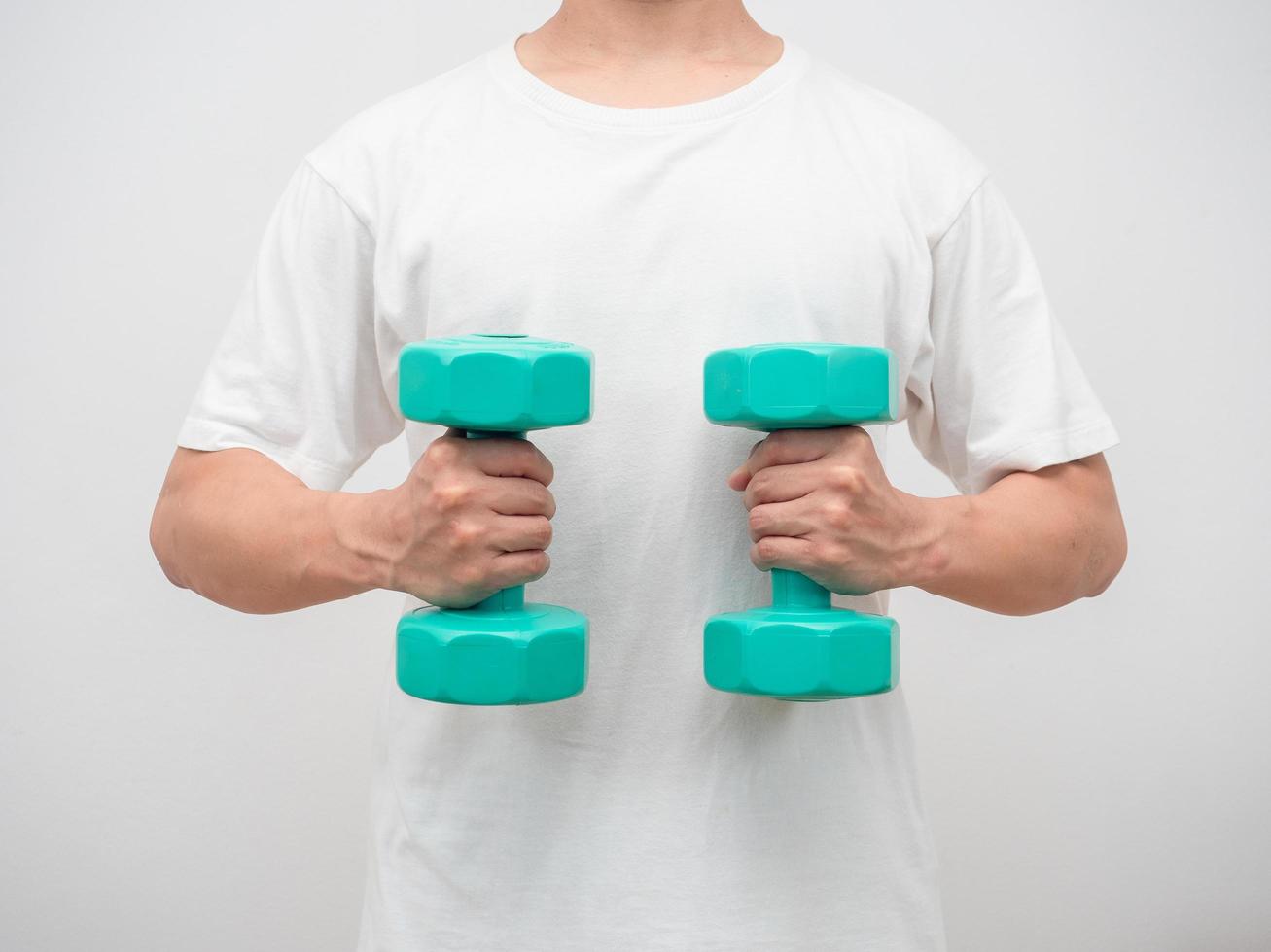 Man holding dumbbell green clolor white background crop shot photo