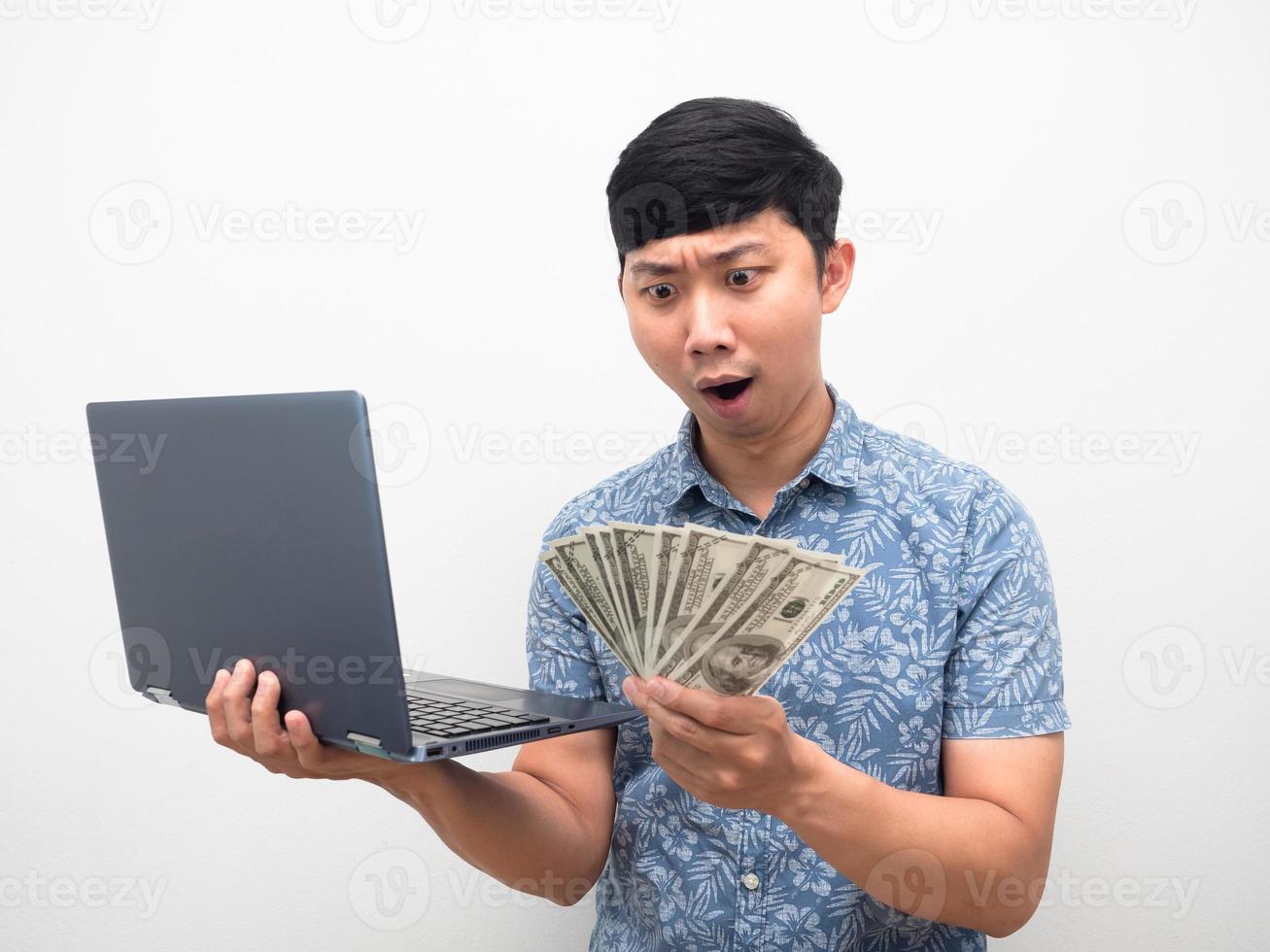 Man get alot of money with working online concept,Man excited looking at money in hand photo