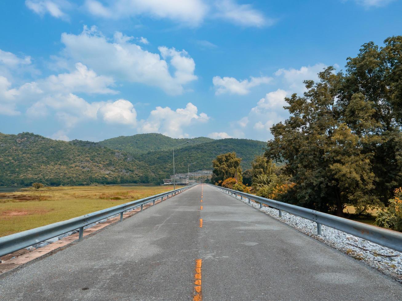 Country road on the mountain with tree in natural and blue sky white cloudy landscape photo