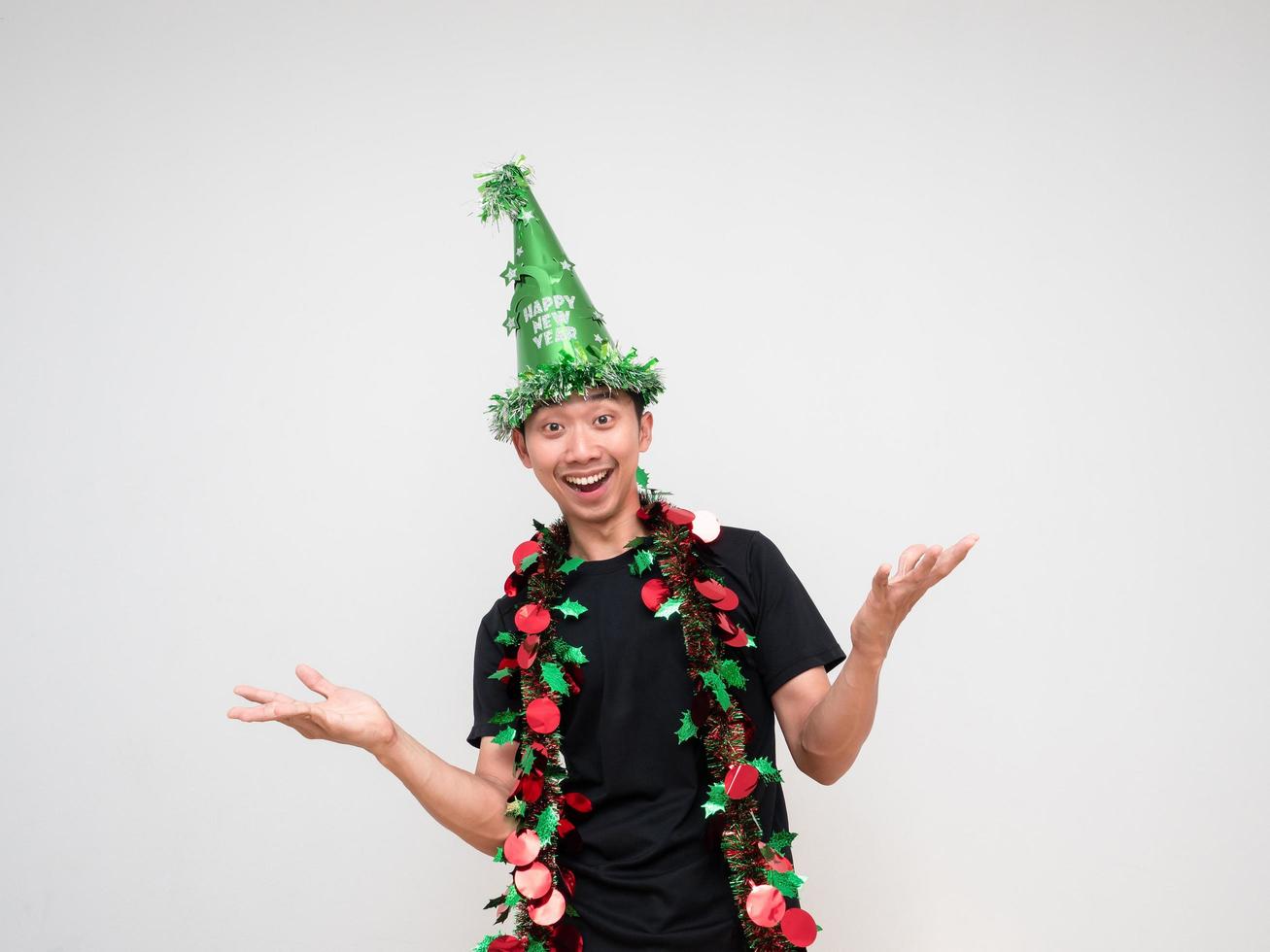 Young man with green hat and tassel colorful hand up happy smile portrait and look at camera on white isolated photo