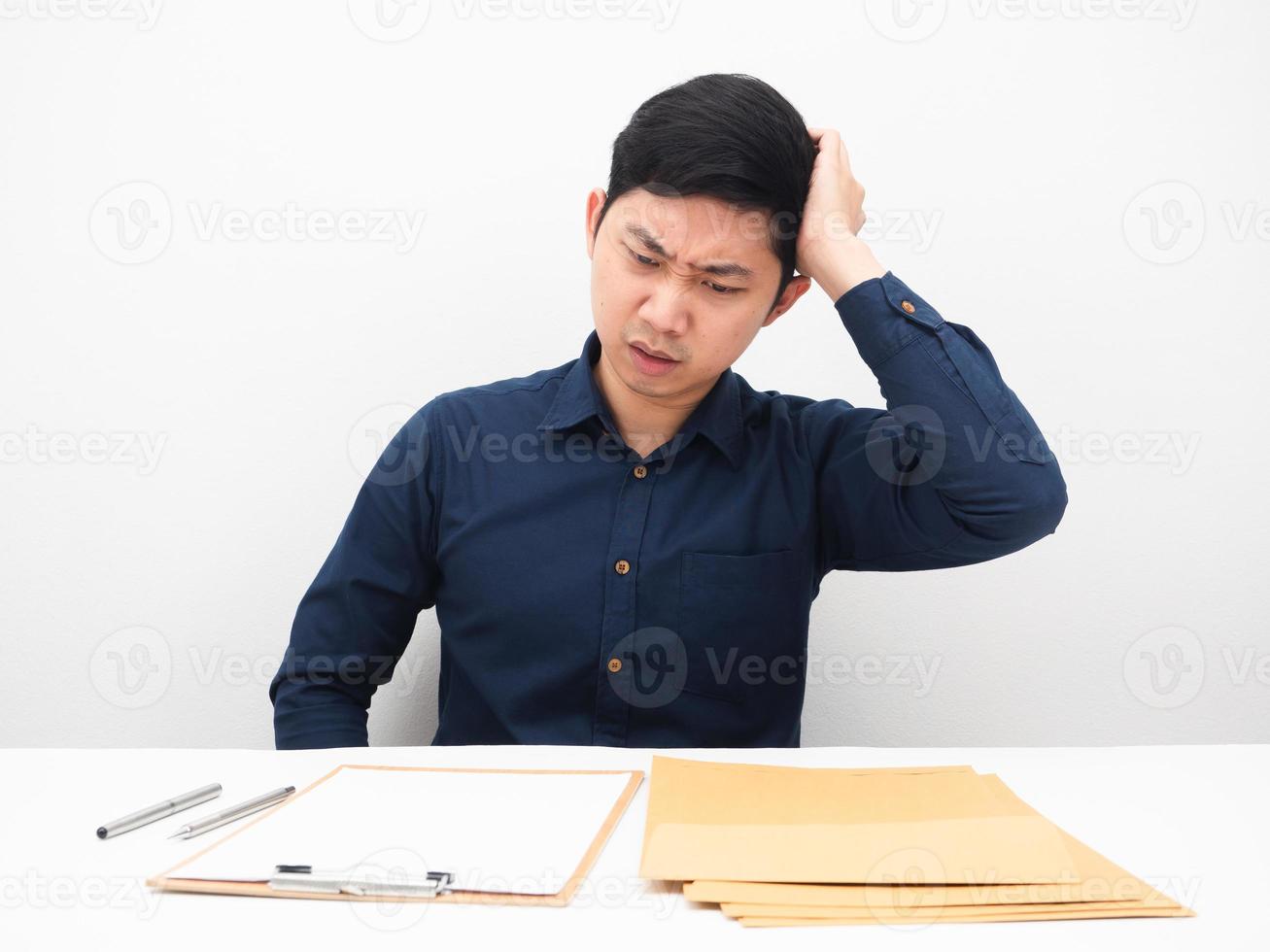 Man feeling headache about many document envolope on table white background photo