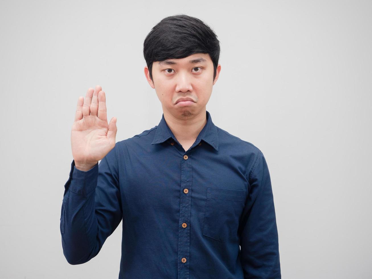 Man felling bored and show one hand up on white background photo