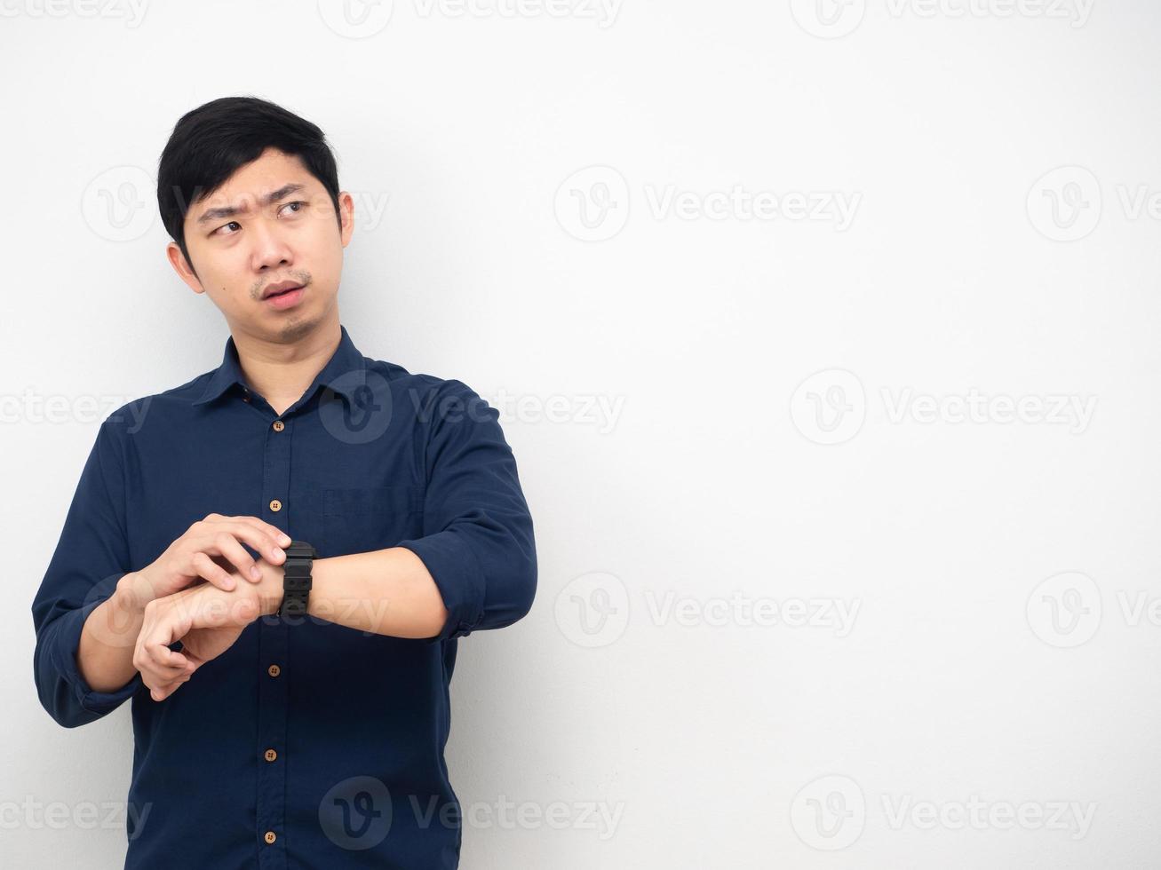 Man wearing watch feeling strain looking at copy space white background photo