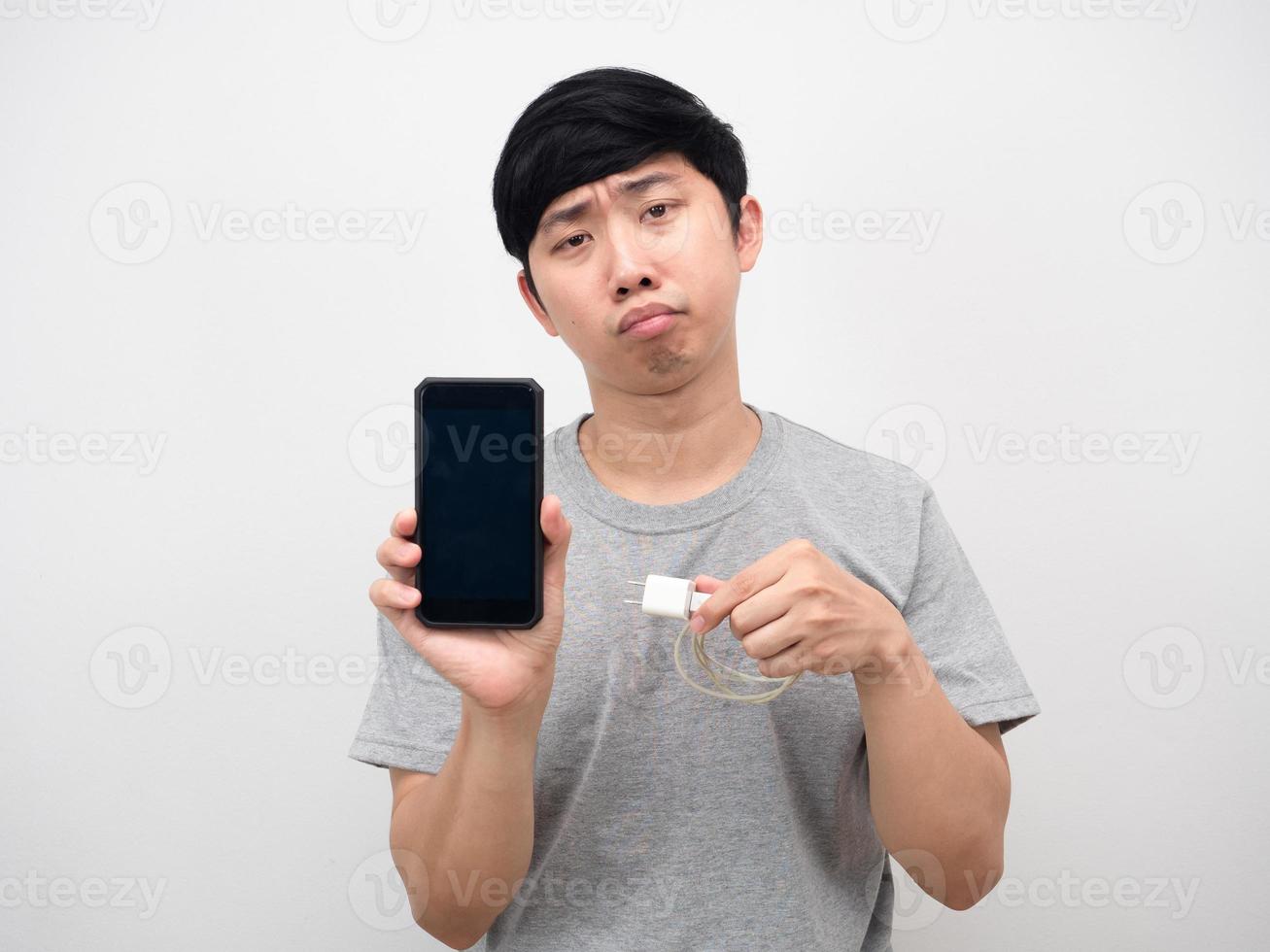 Man holding mobile phone and charging mobile bored emotion photo