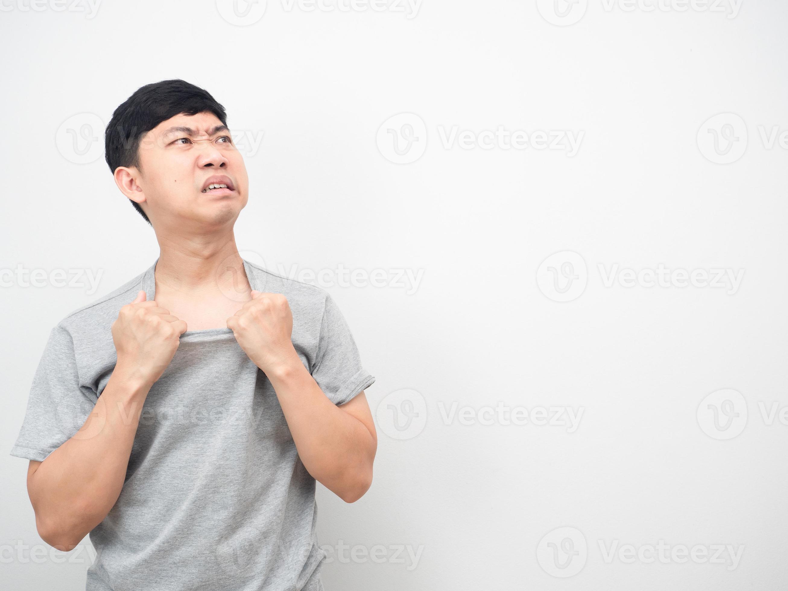 Man feeling heat stroke with hot weather gesture looking at copy space