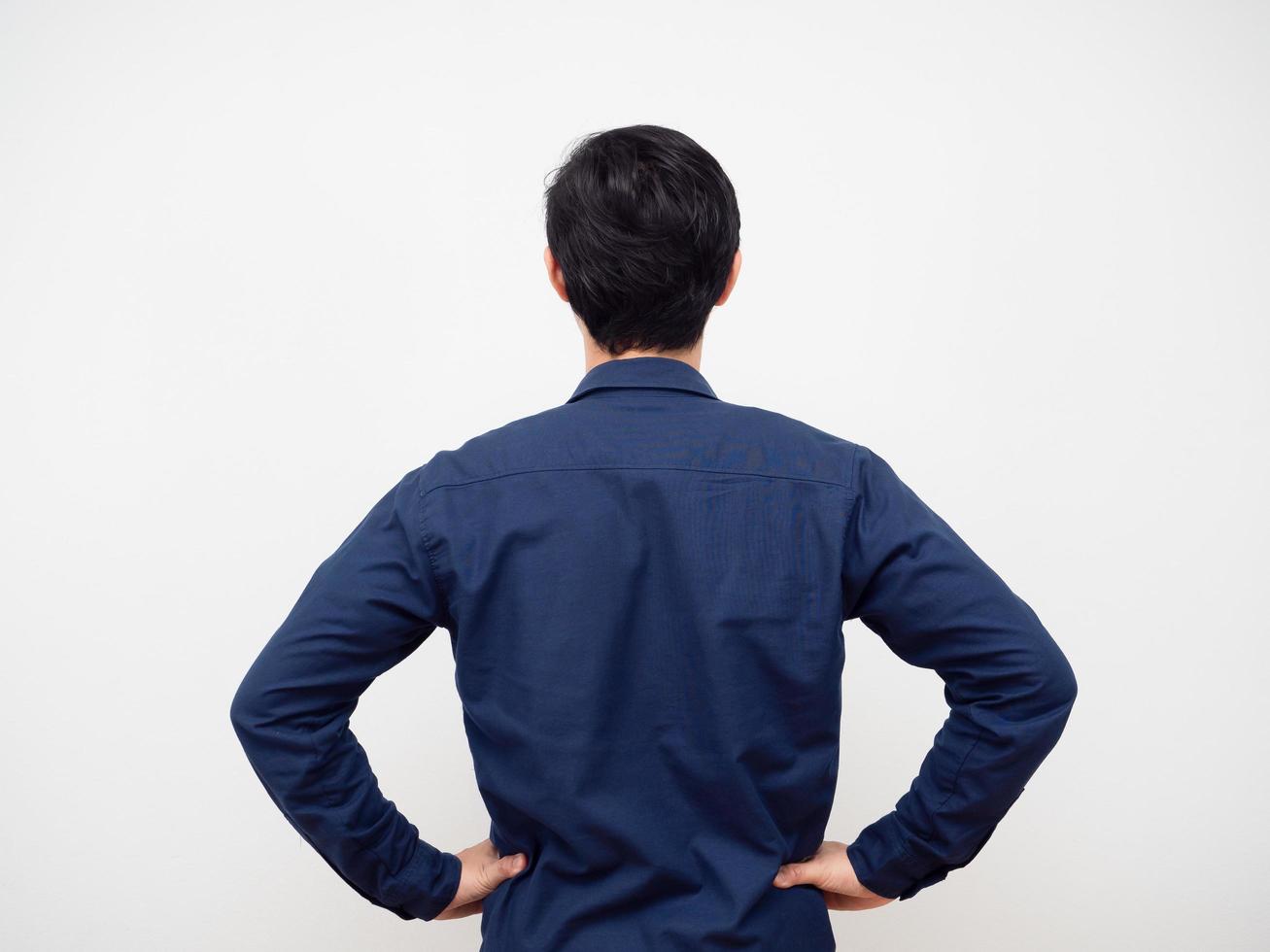 Man standing turn back hand at his waist white background photo