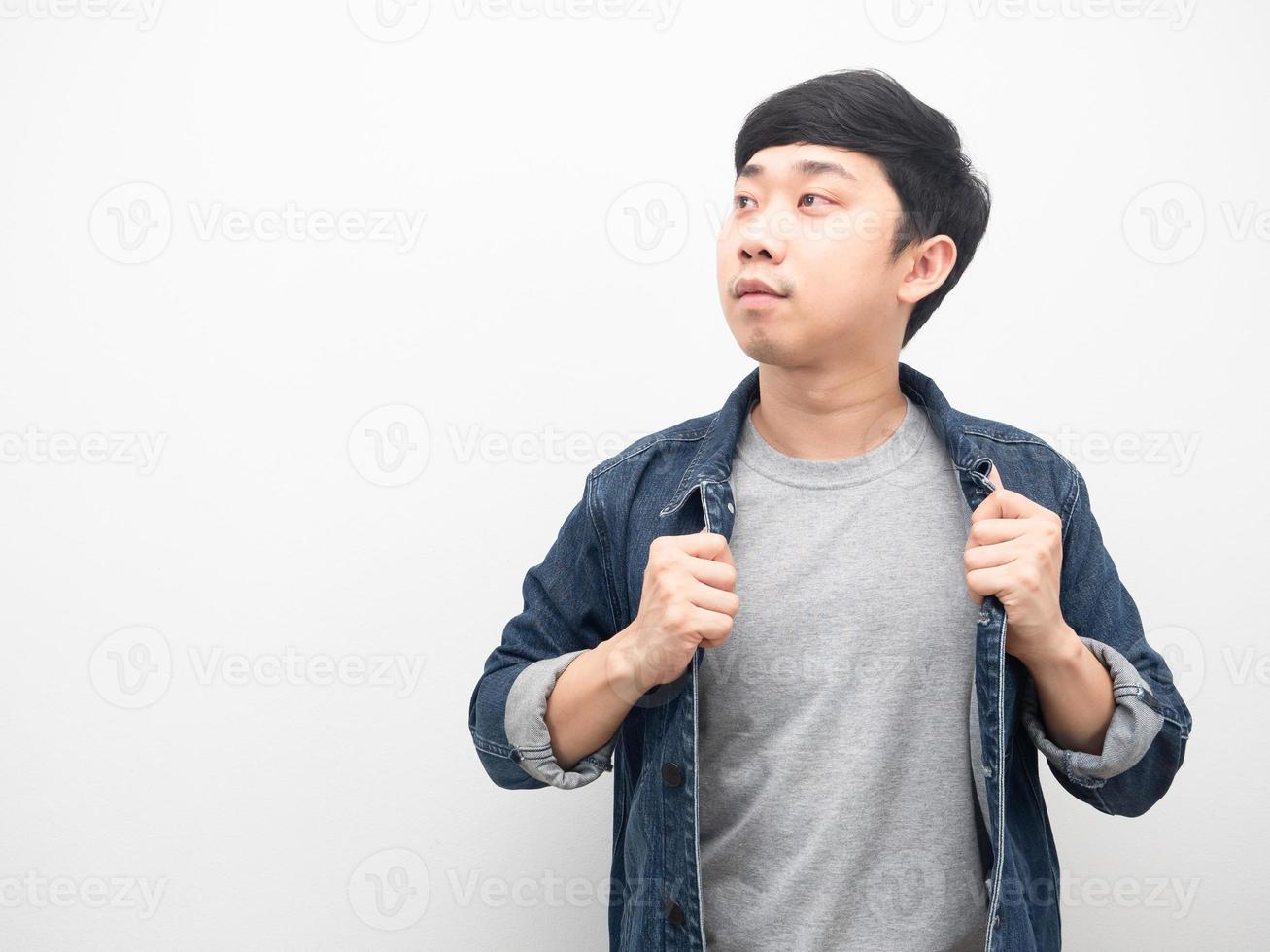 Handsome man wearing jean shirt looking at copy space photo