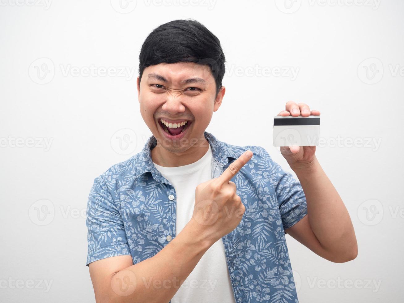 Man point finger at credit card happy emotion portrait photo