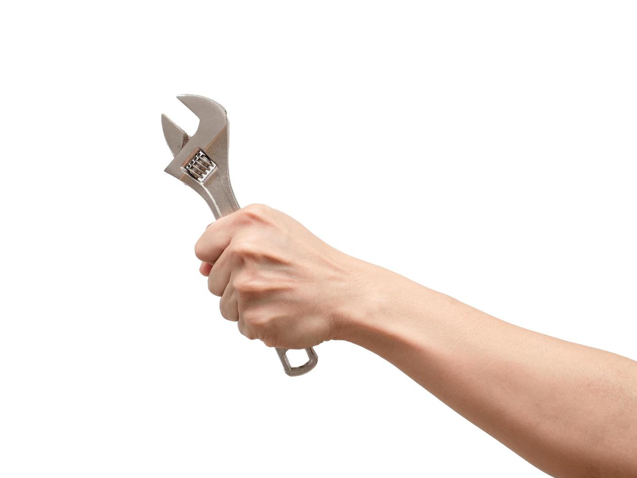 Hand holding adjustable wrench on white isolated background,Labor tool technician photo