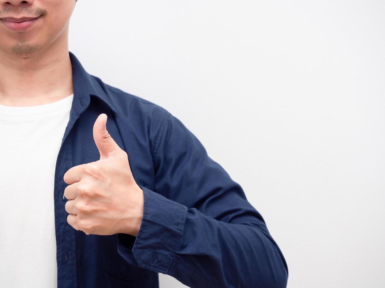 Portrait asian man thumb up with smile at face crop body with copy space white background photo