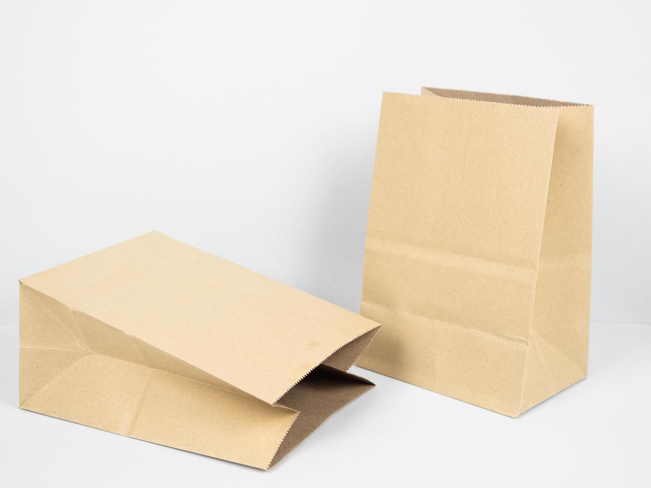 Kraft paper bag on white isolated background recycle concept photo