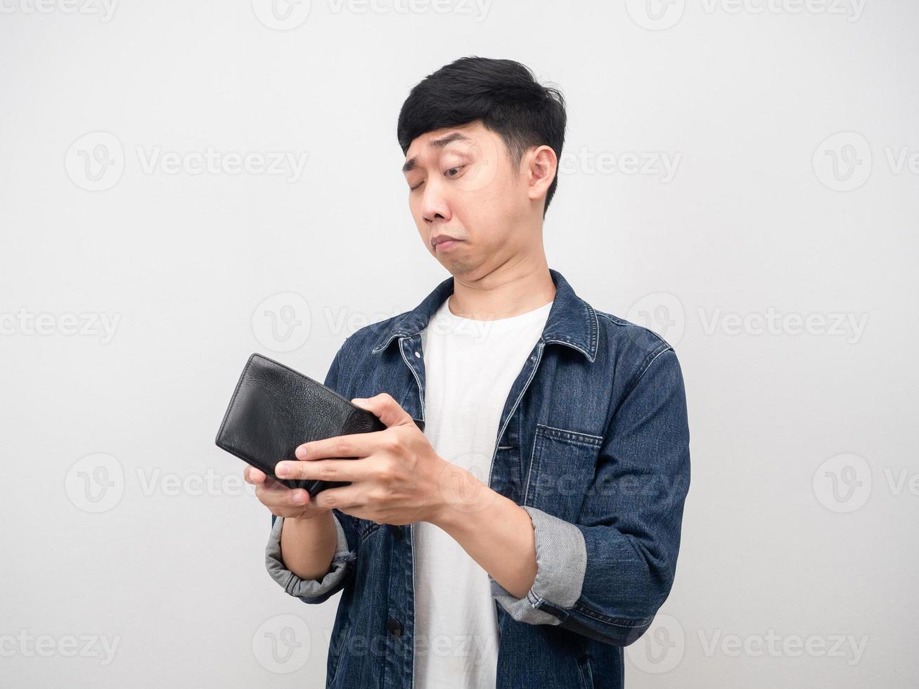 Asian man jean shirt don't dare to look at his wallet because no money photo