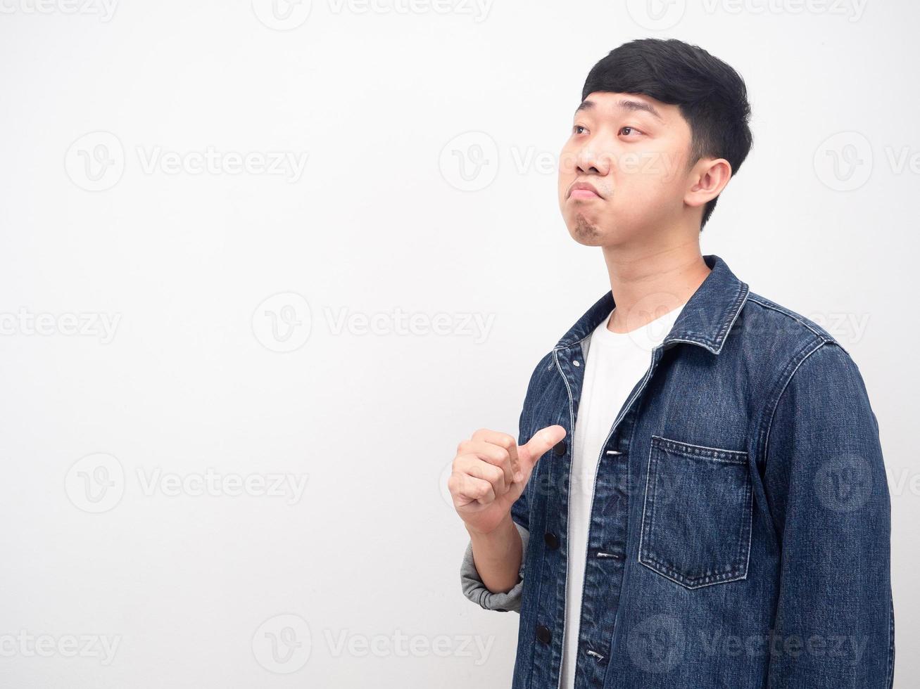 Asian man jean shirt point finger at himself arrogant face looking at copy space photo