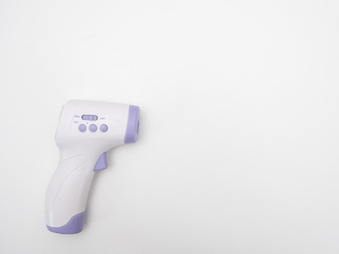 Infrared thermometer scan on white background copy space photo