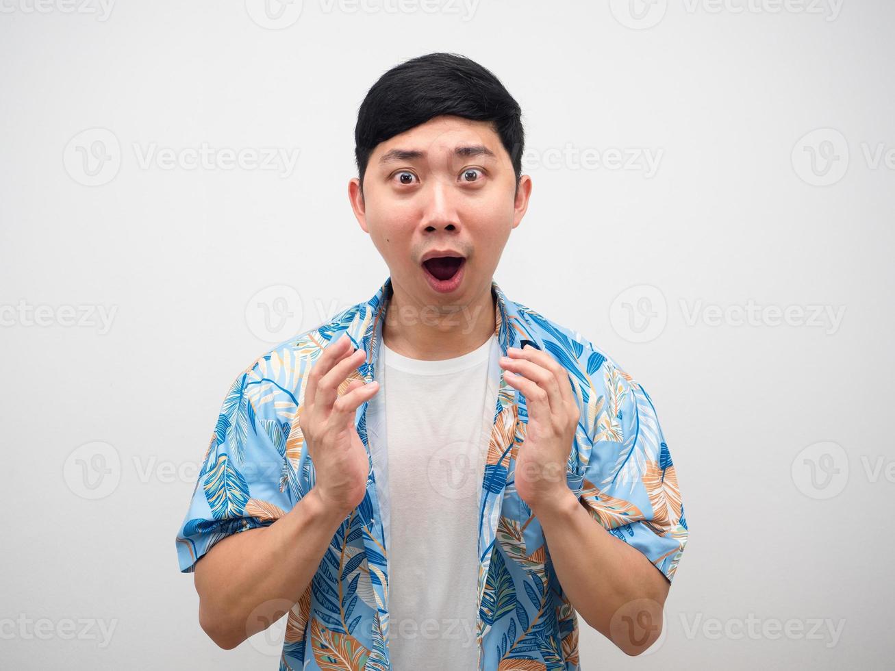 Man blue shirt gesture amazed looking at camera portrait photo